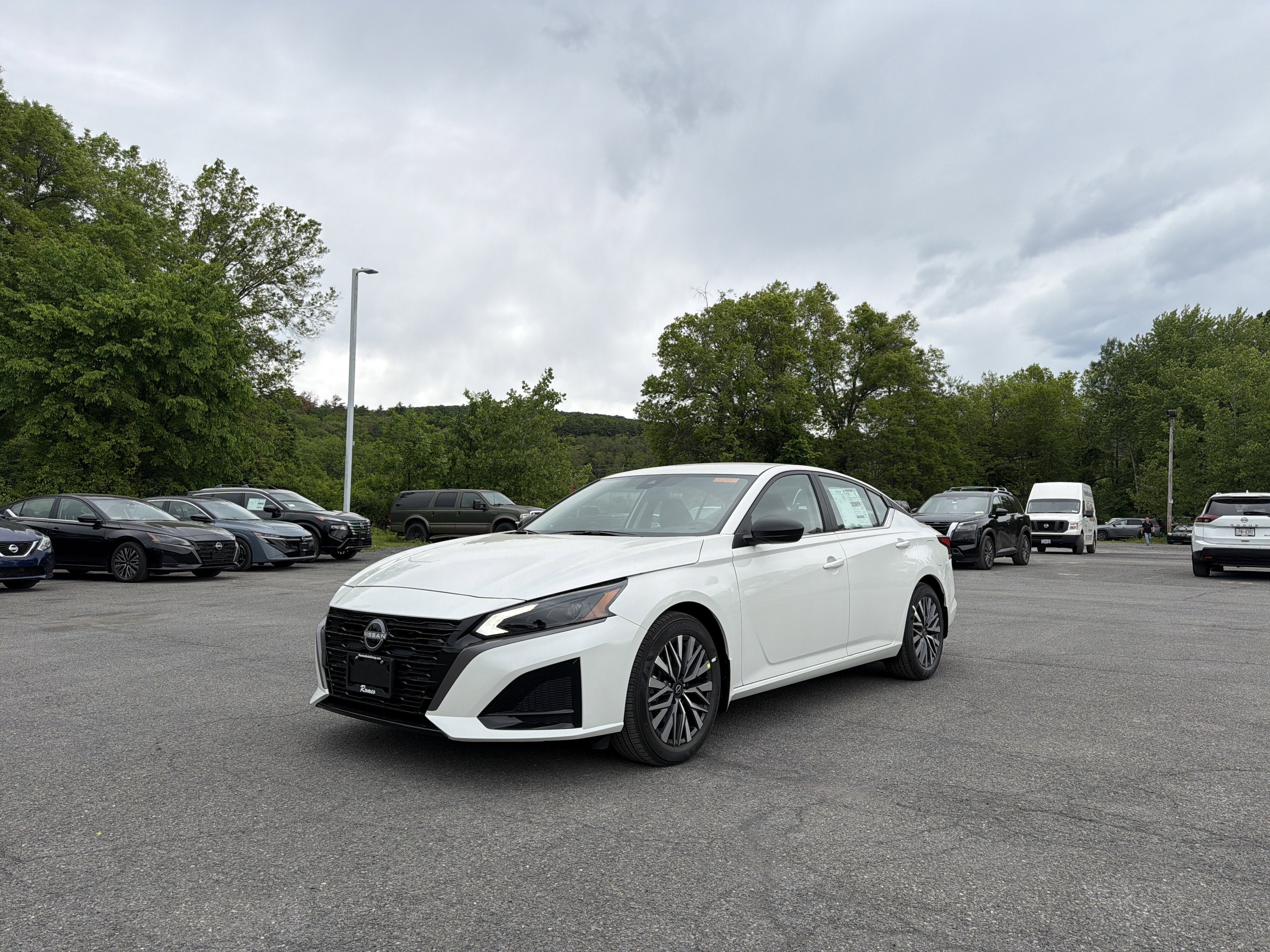 2026 Nissan Altima SV in Pearl White Tricoat — front three-quarter view