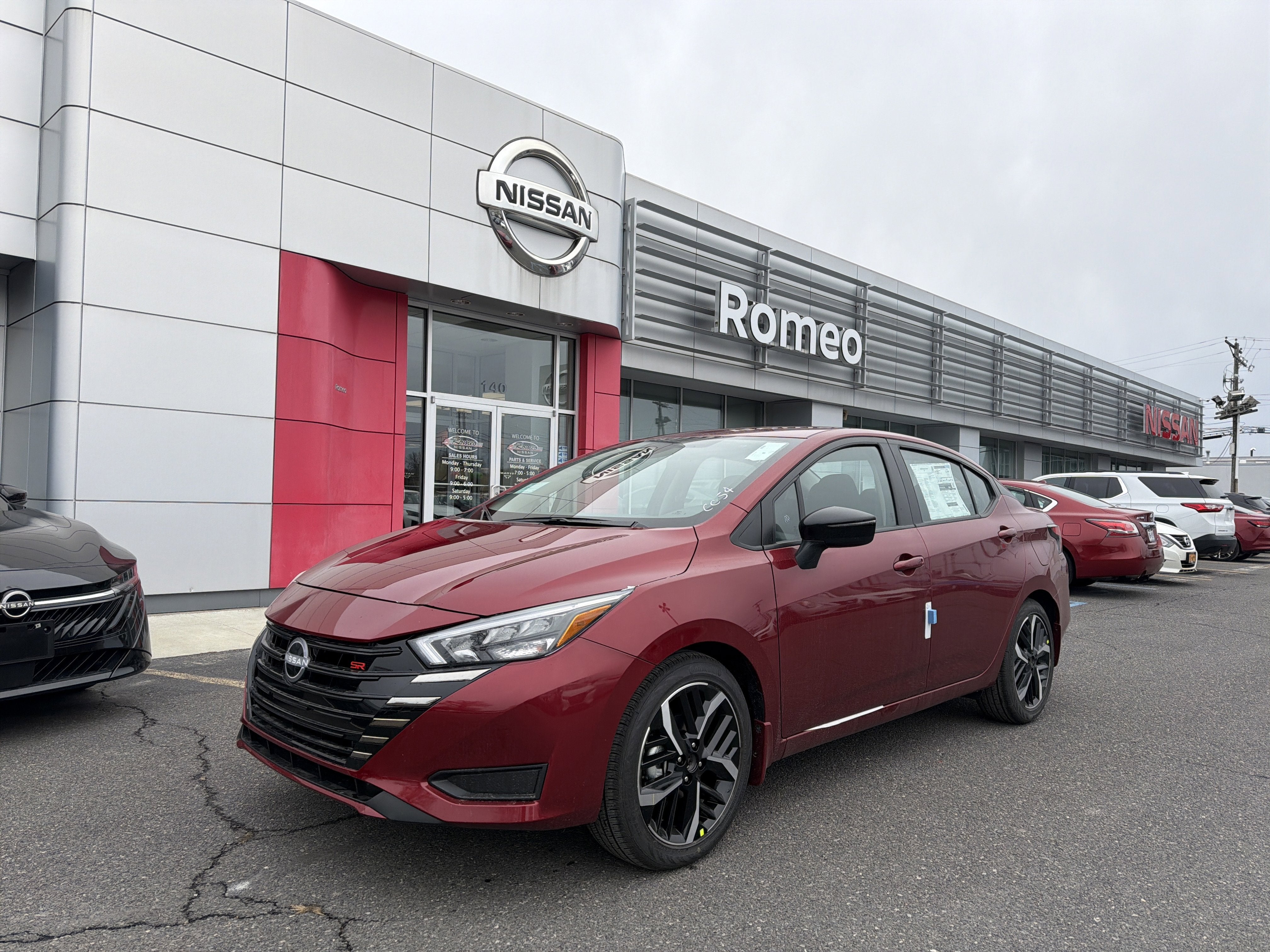 2025 Nissan Versa SR in Scarlet Ember Tintcoat — front three-quarter view