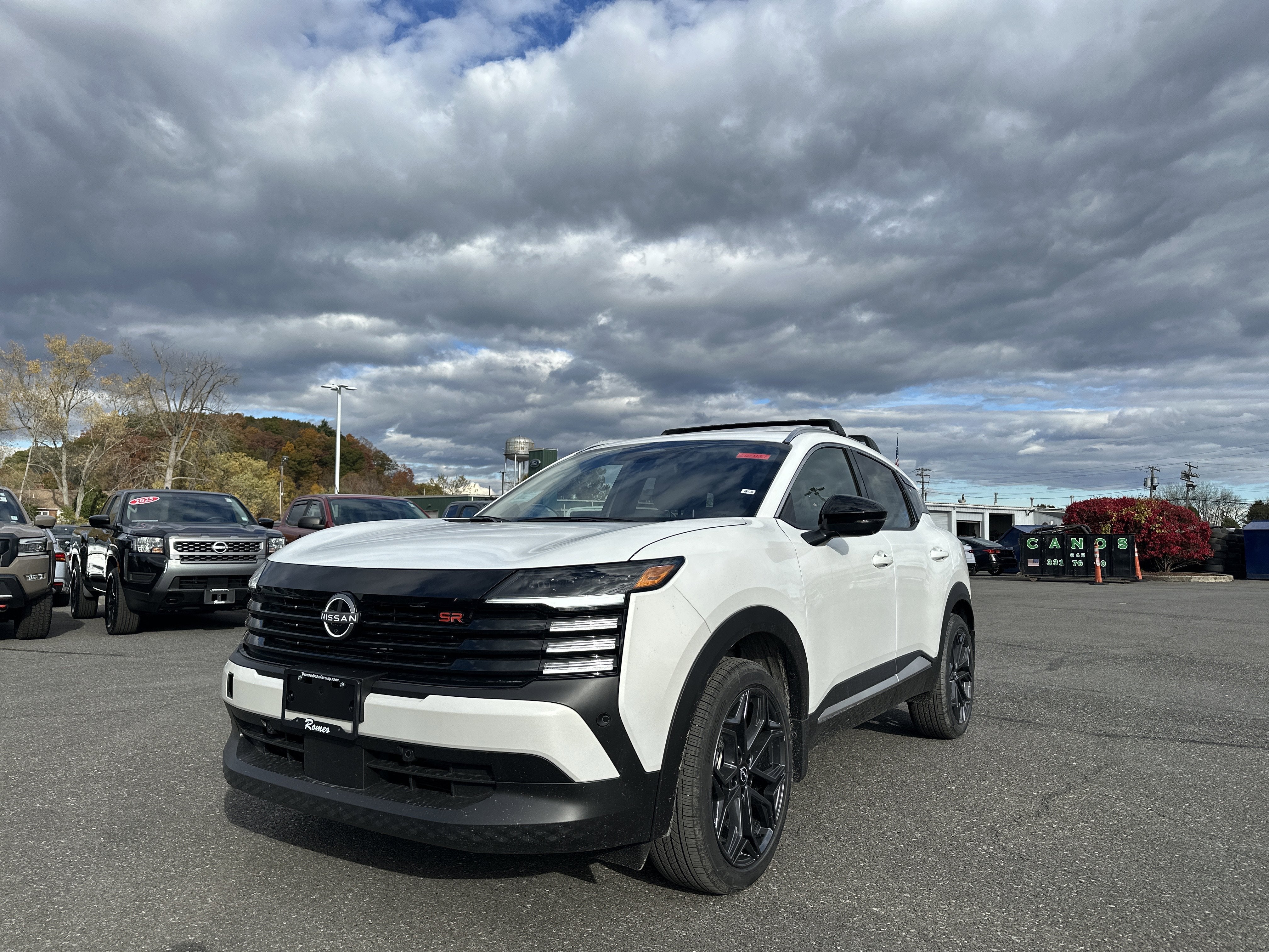 2026 Nissan Kicks SR in Aspen White Tricoat — front three-quarter view