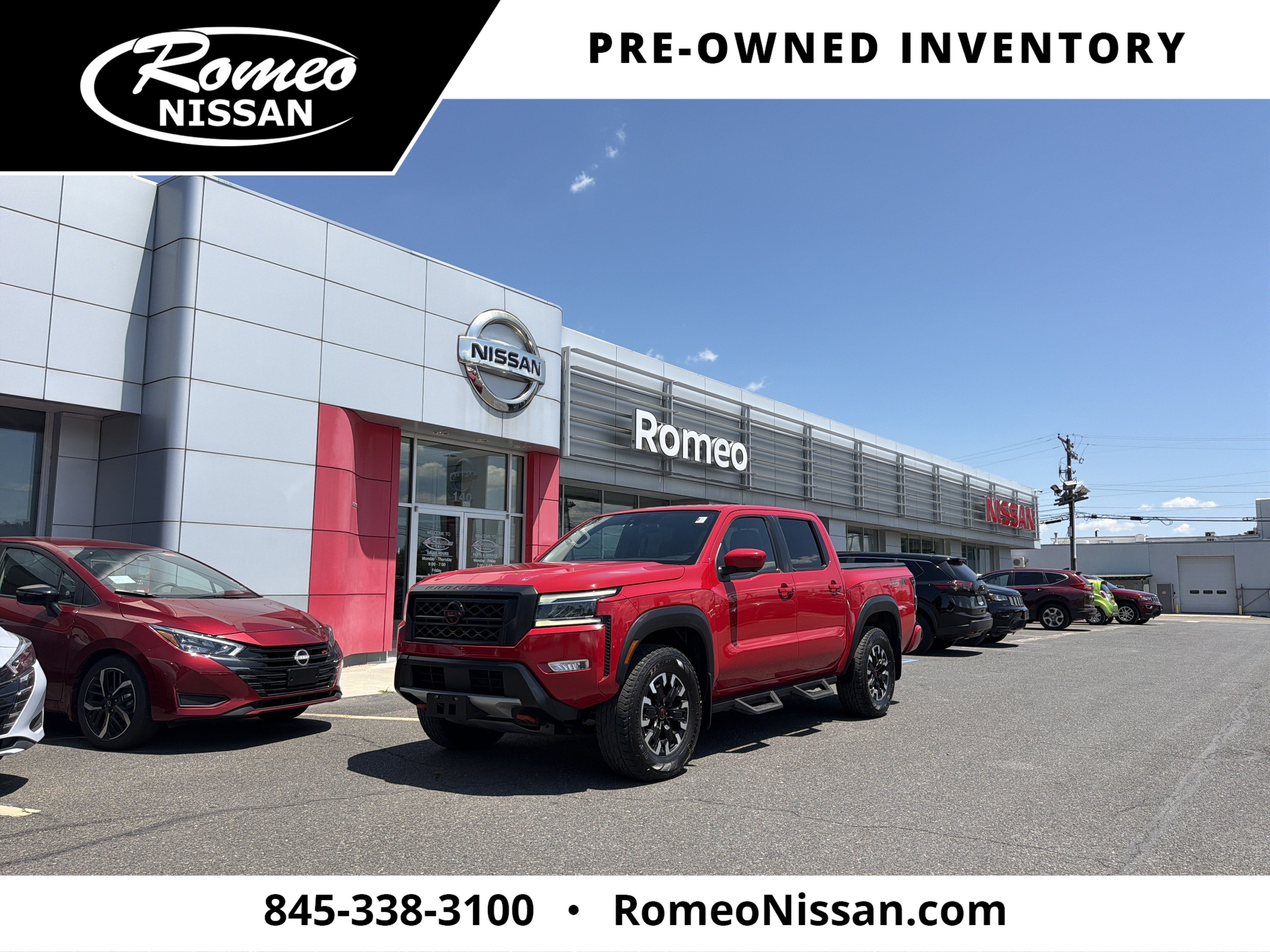 2023 Nissan Frontier PRO-4X in Red Alert — front three-quarter view