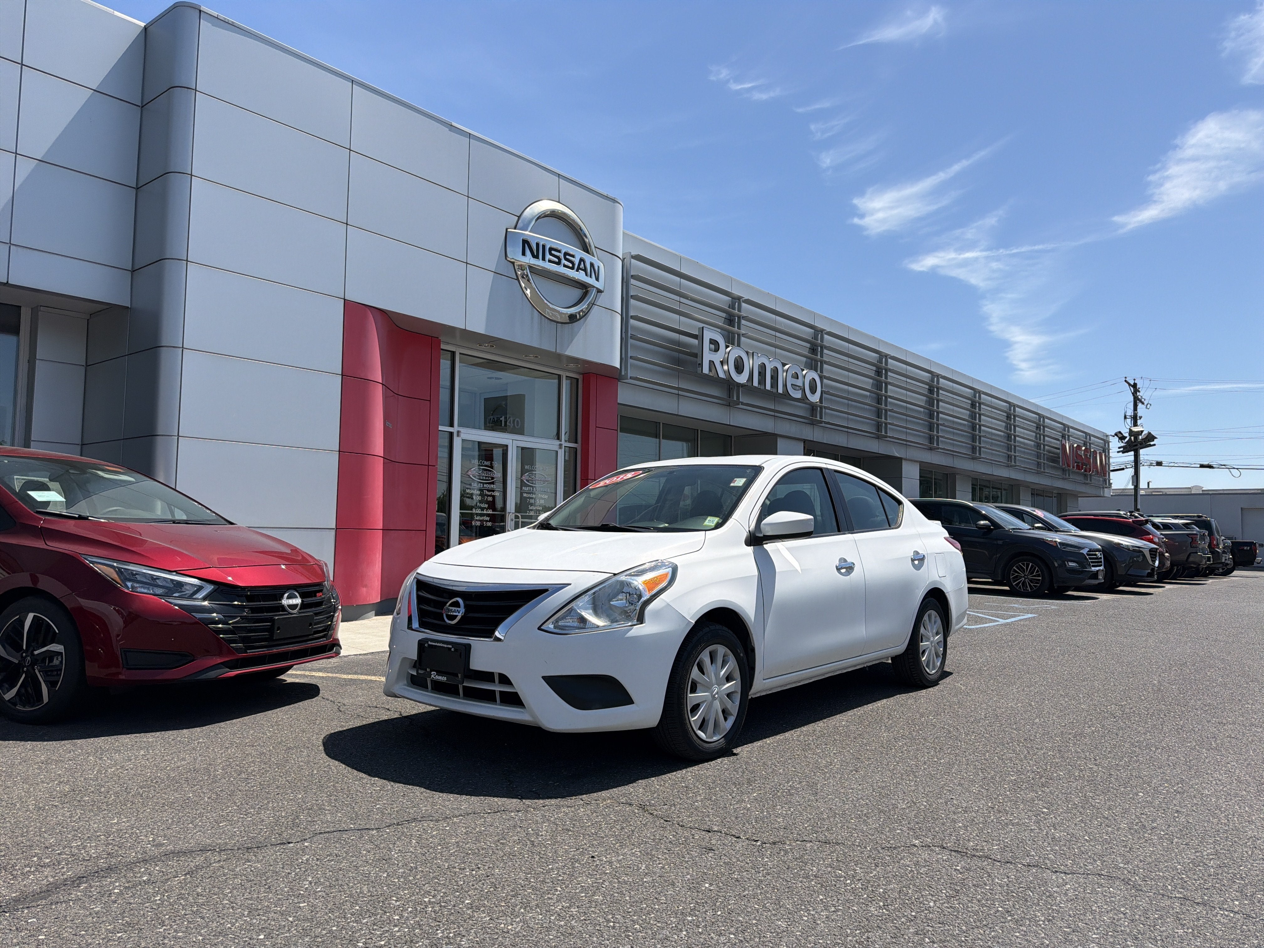2018 Nissan Versa 1.6 SV in Fresh Powder — front three-quarter view